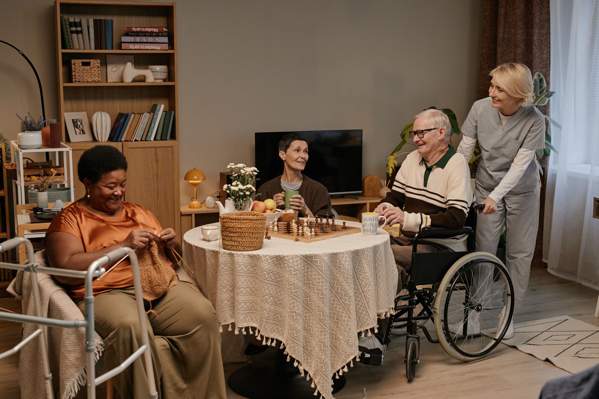 Senior Multiethnic Group Socializing and Smiling in Nursing Home Setting