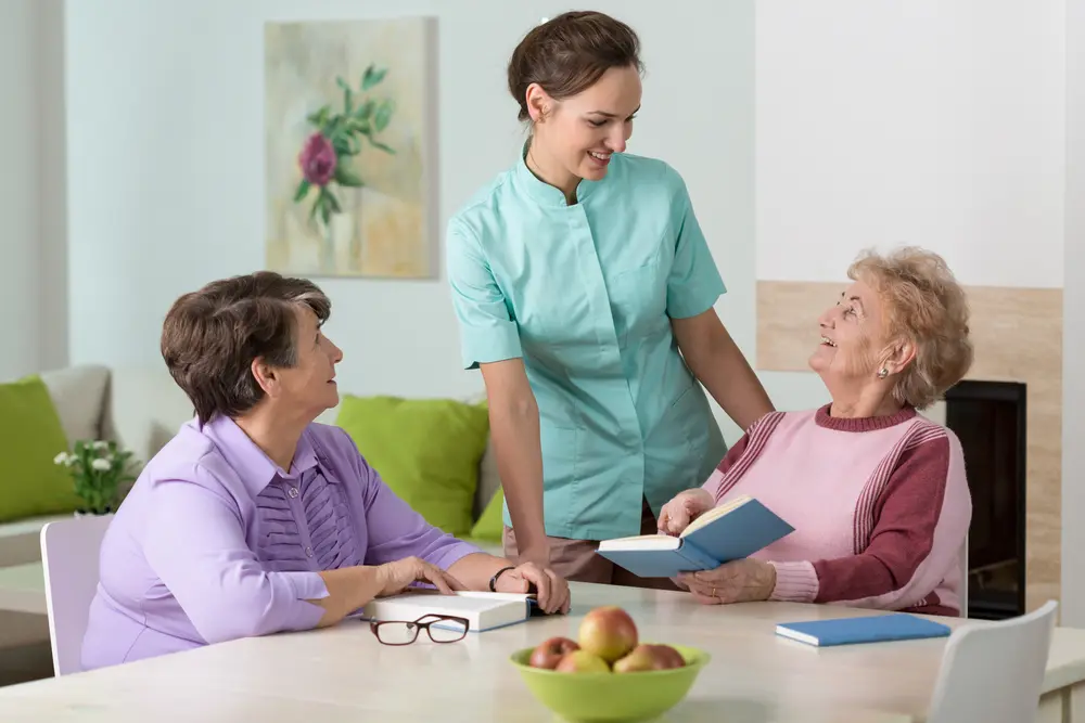 Nurse providing skilled nursing care for elderly residents with daily health support at Nirvana House