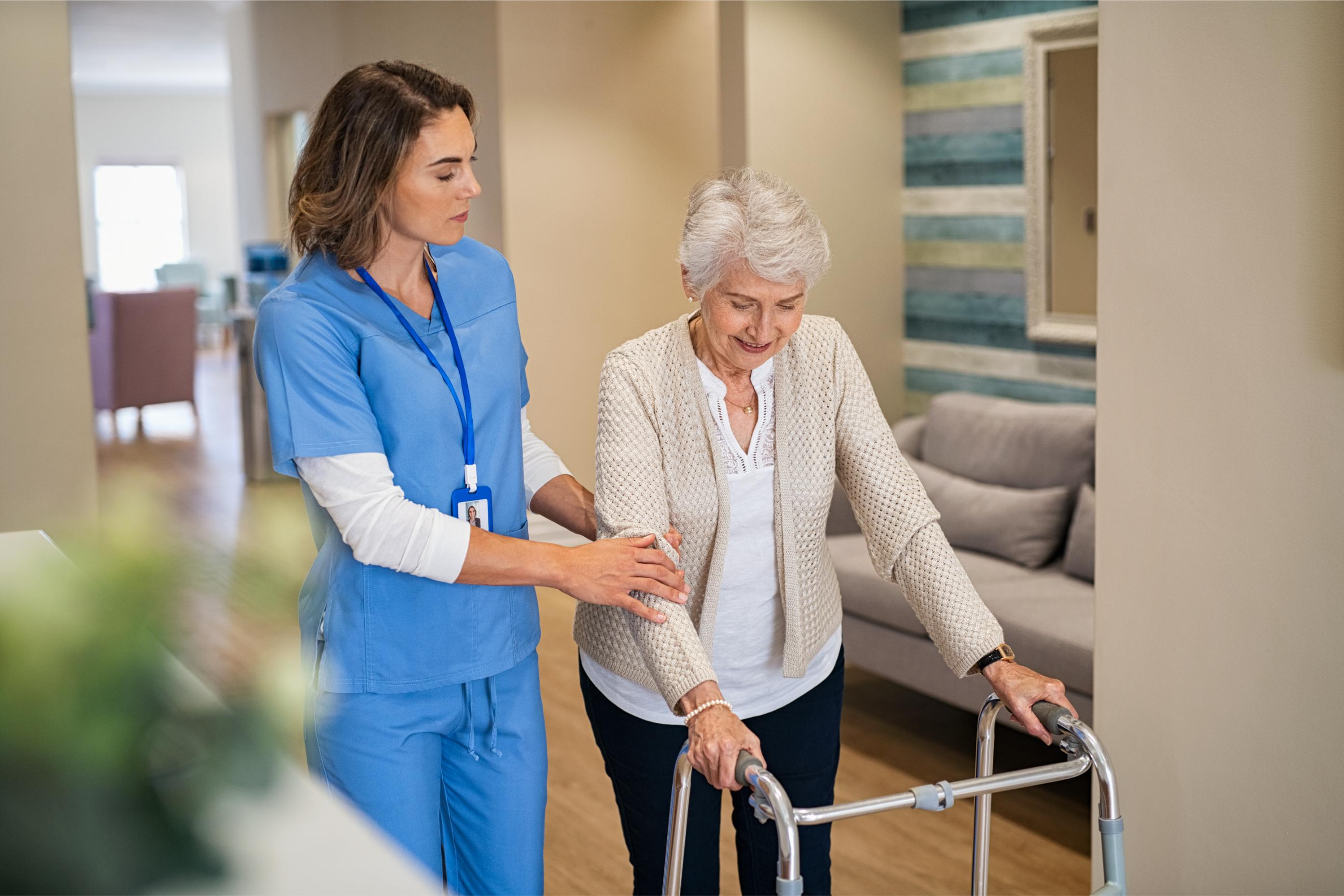 Elderly woman using a walker at home, a sign a senior may need more consistent daily support